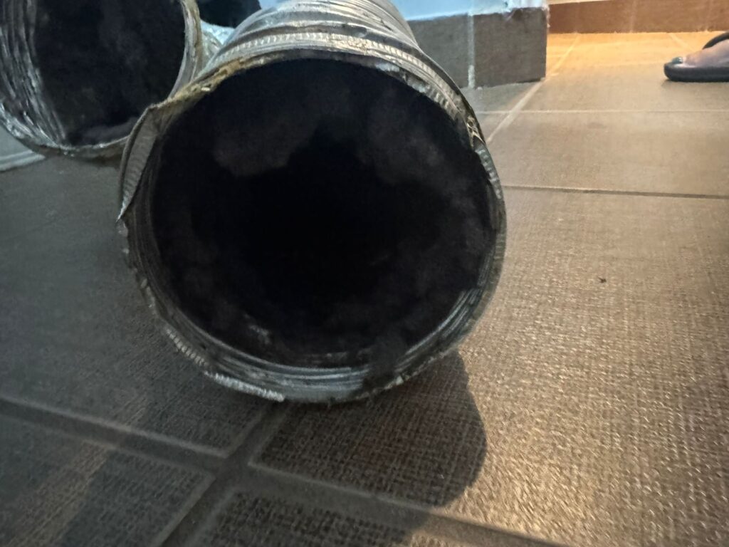 Flexible dryer duct interior completely blocked with lint — dryer vent cleaning Thornhill