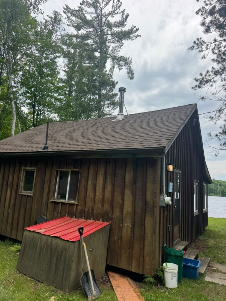 Ontario lakeside cottage with wood stove chimney — WETT certification inspection